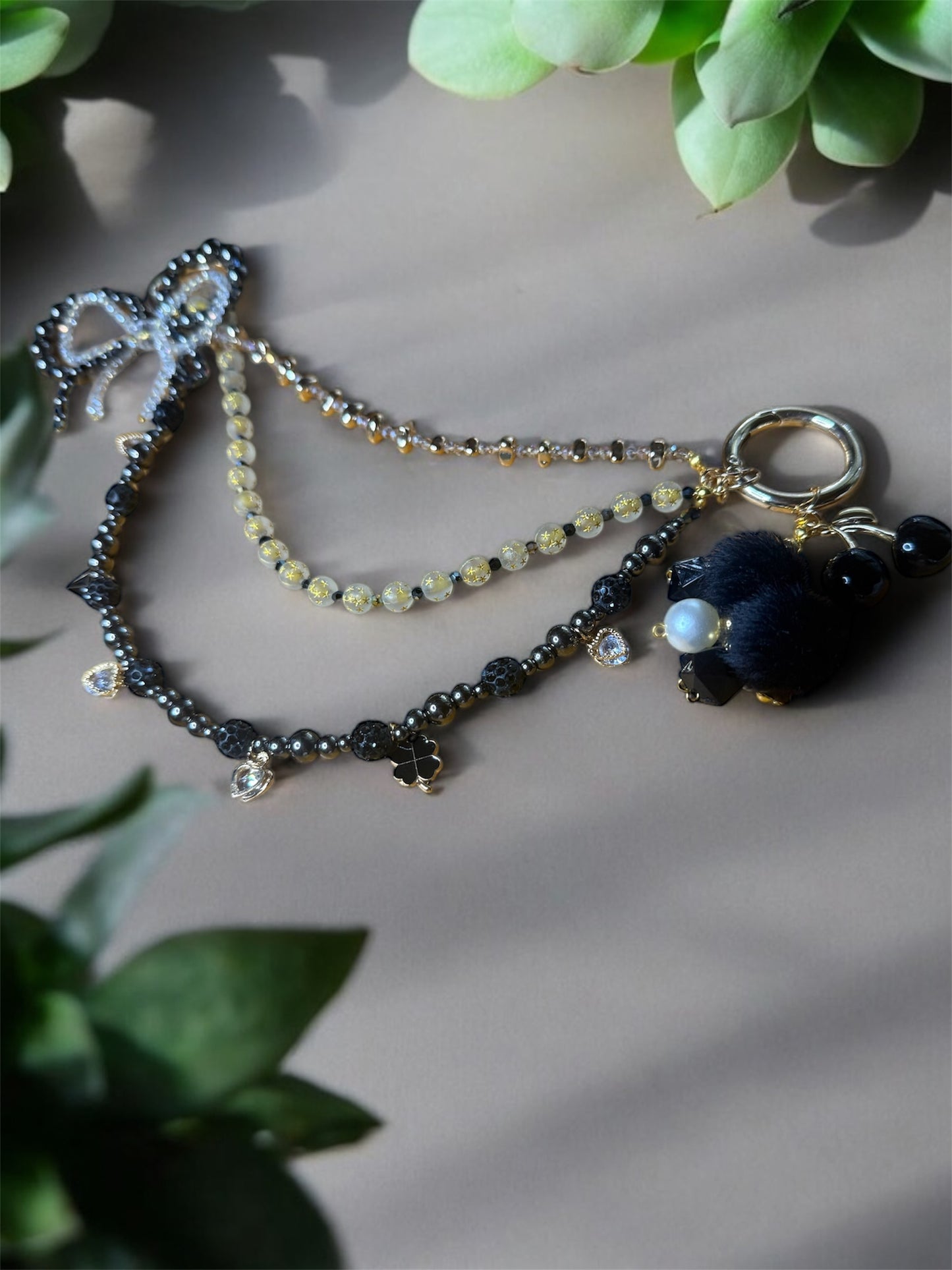 Sparkly black/gold charm