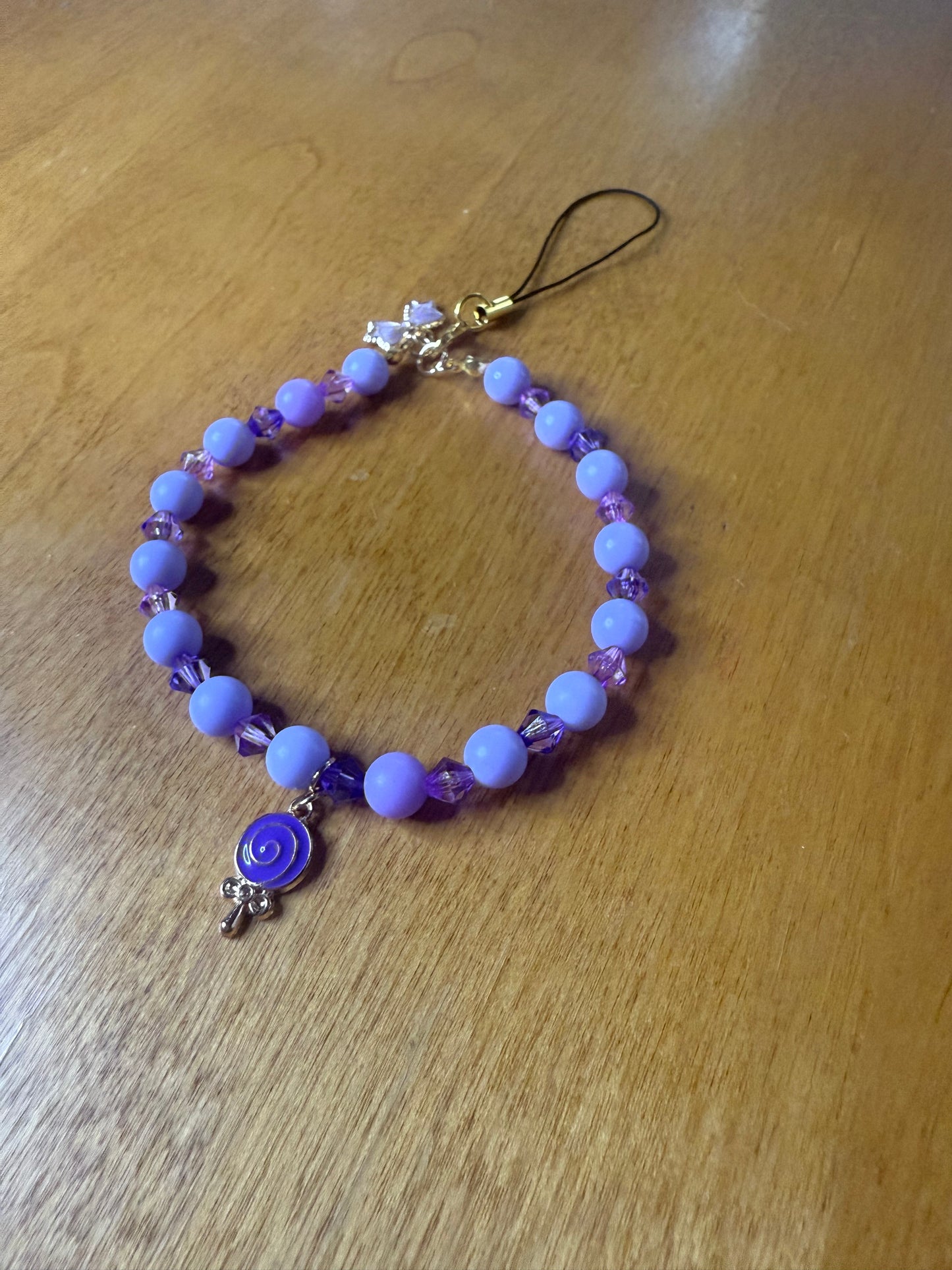 Purple lollipop bracelet/phone charm