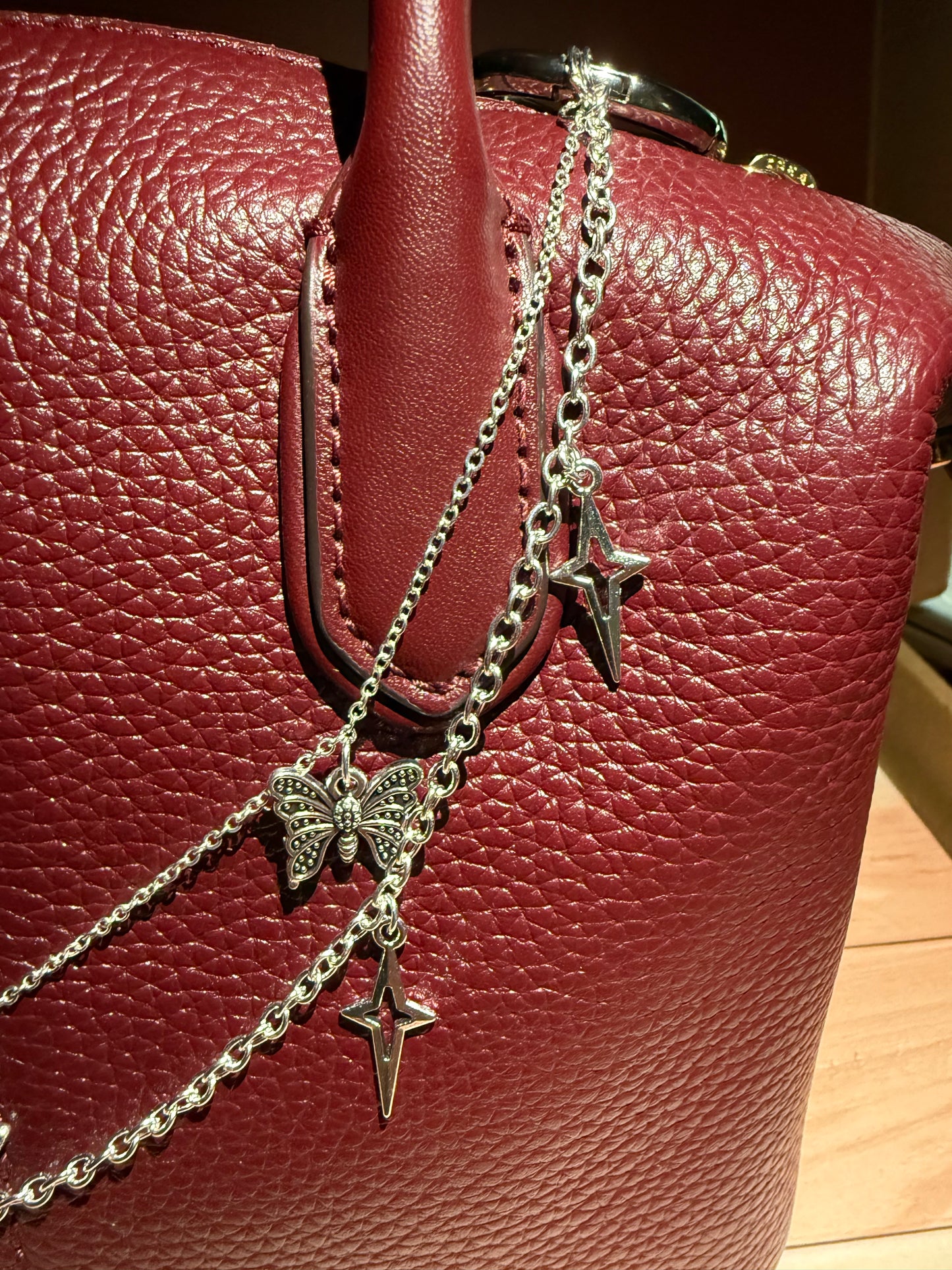 Silver starbutterfly charm