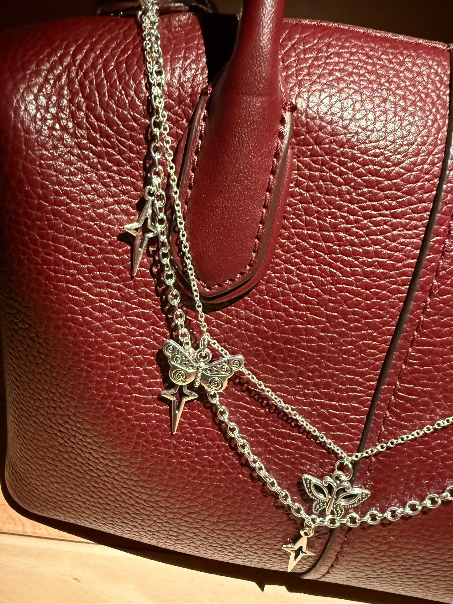 Silver starbutterfly charm