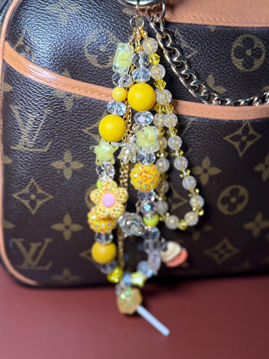 Yellow glamsucker purse charm