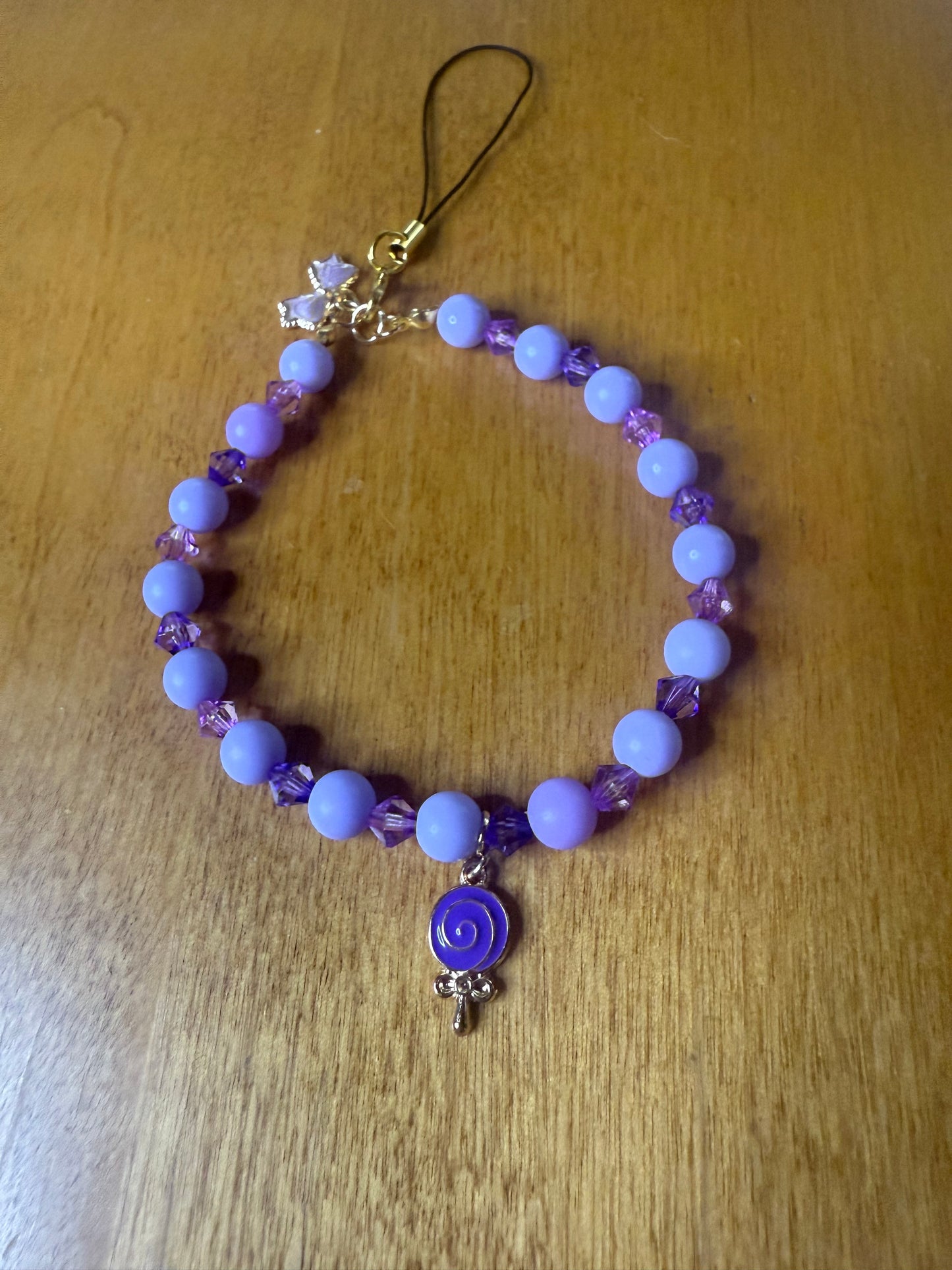 Purple lollipop bracelet/phone charm