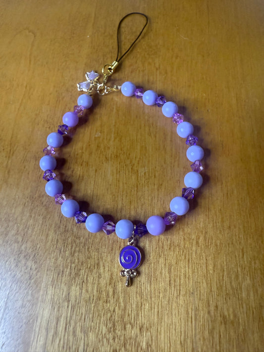Purple lollipop bracelet/phone charm